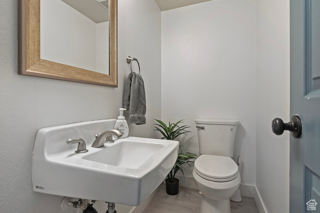 Bathroom with tile floors, sink, and toilet