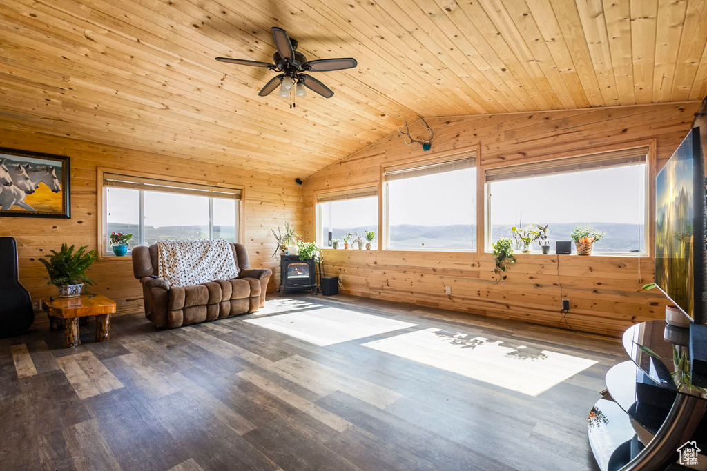 Interior space with wood ceiling, plenty of natural light, ceiling fan, and vaulted ceiling