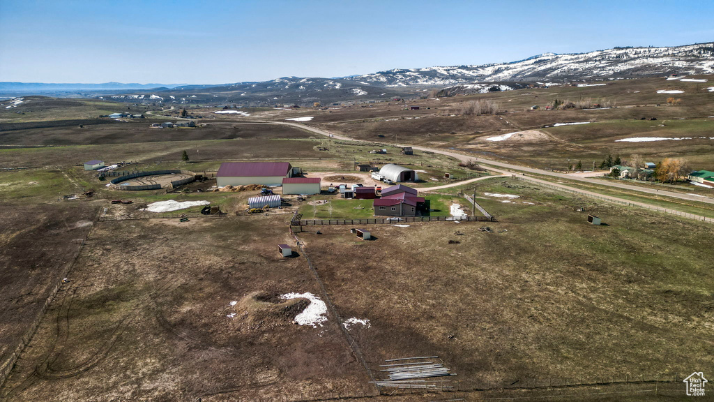 Drone / aerial view with a mountain view and a rural view