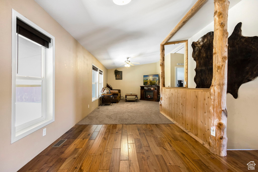 Corridor with hardwood / wood-style flooring