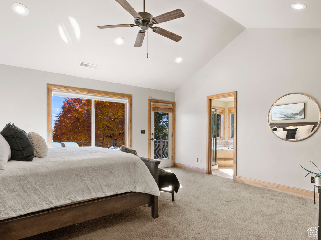 Bedroom with ensuite bath, high vaulted ceiling, ceiling fan, and multiple windows