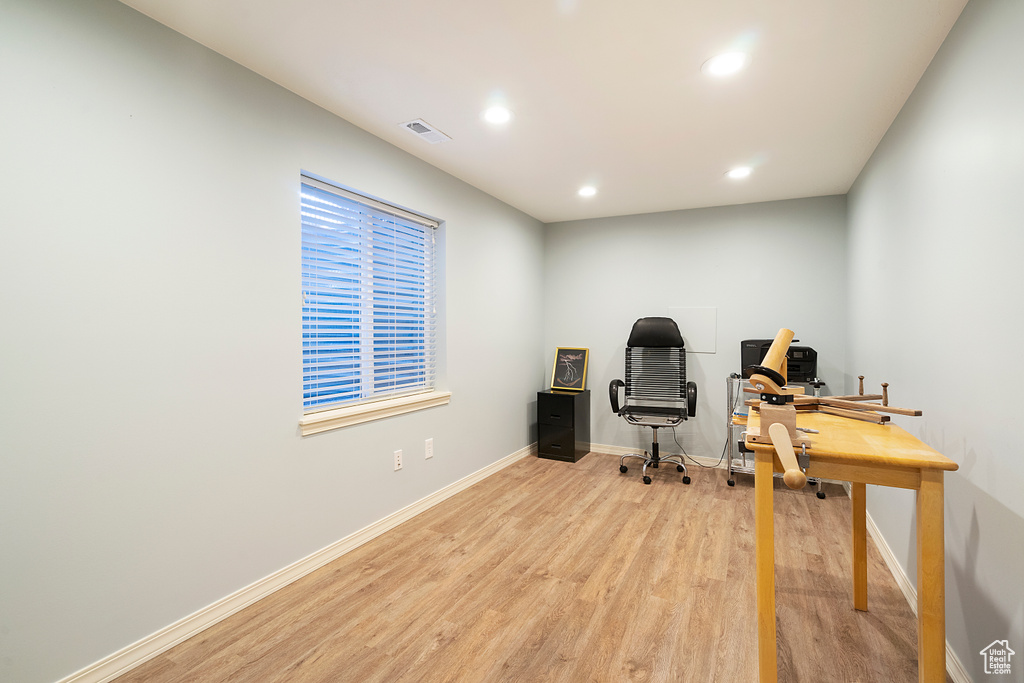 Office area featuring light hardwood / wood-style flooring