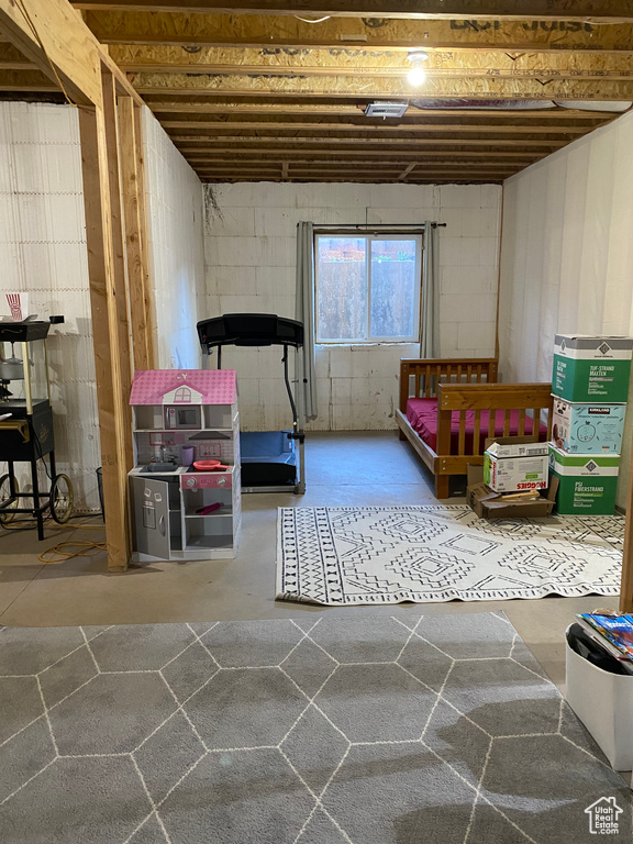 Playroom with concrete flooring