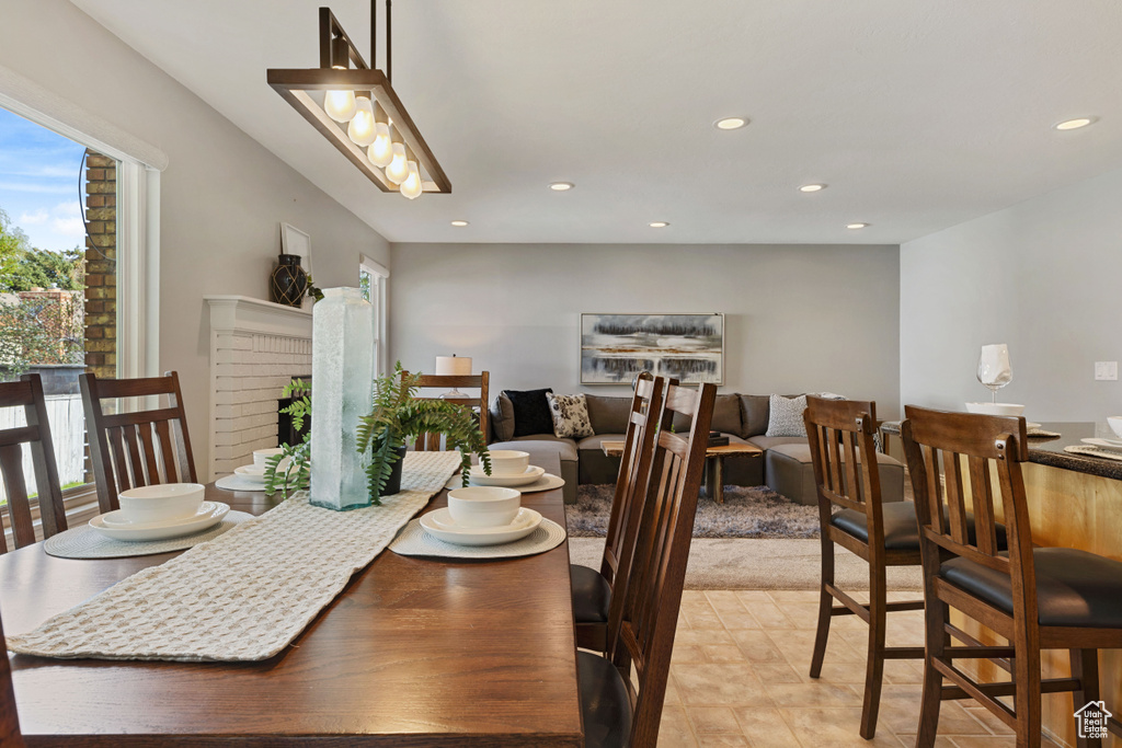 Dining space featuring light tile flooring