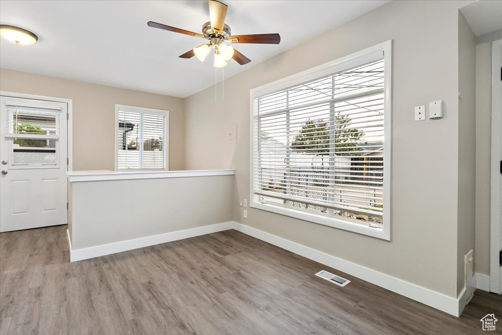 Spare room featuring hardwood / wood-style floors and ceiling fan