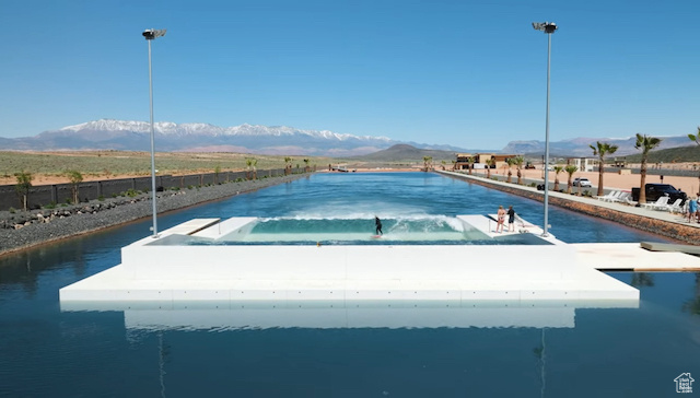 Exterior space with a water and mountain view