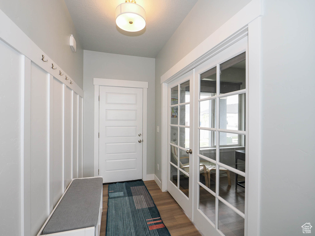 Entryway featuring hardwood / wood-style flooring and french doors
