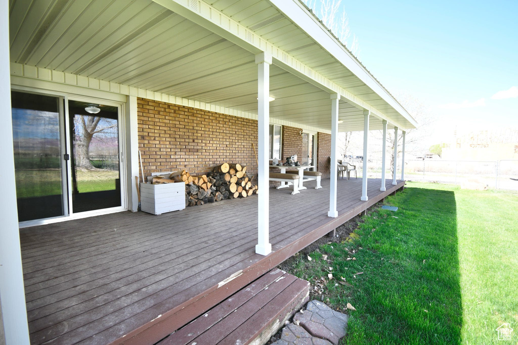 Deck featuring a yard