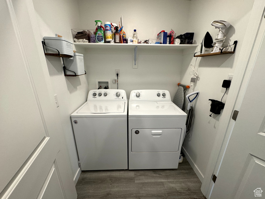 Laundry room featuring dark hardwood / wood-style floors, independent washer and dryer, and hookup for a washing machine