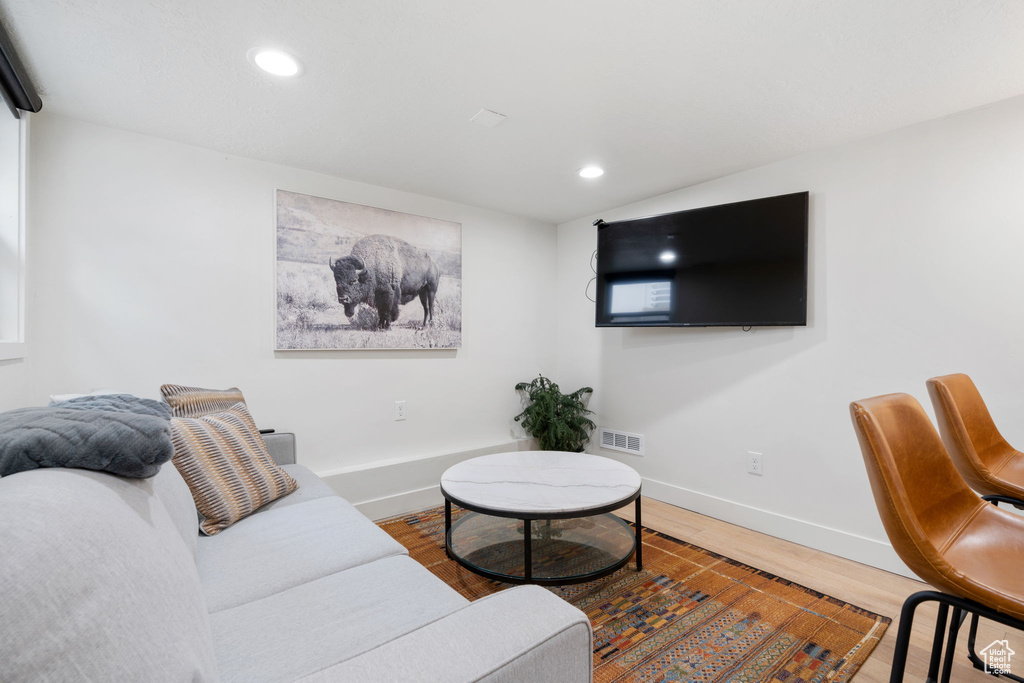 Living room with wood-type flooring