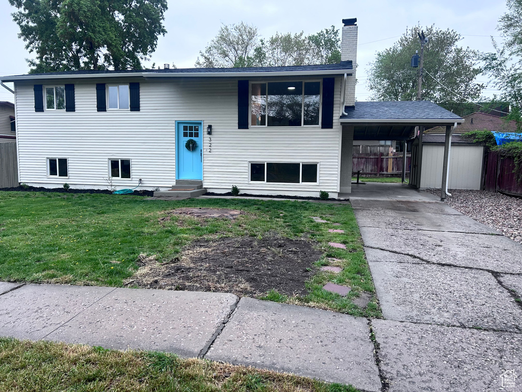 Bi-level home with a front lawn