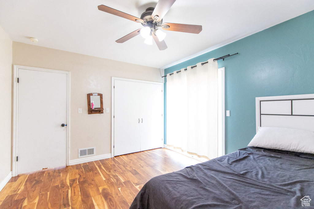 Bedroom featuring ceiling fan and hardwood / wood-style floors