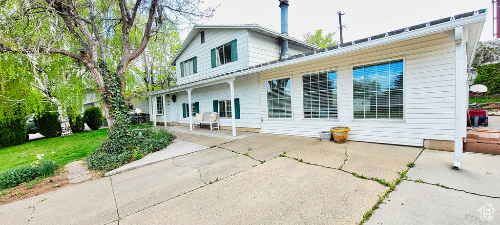 Rear view of property featuring a patio