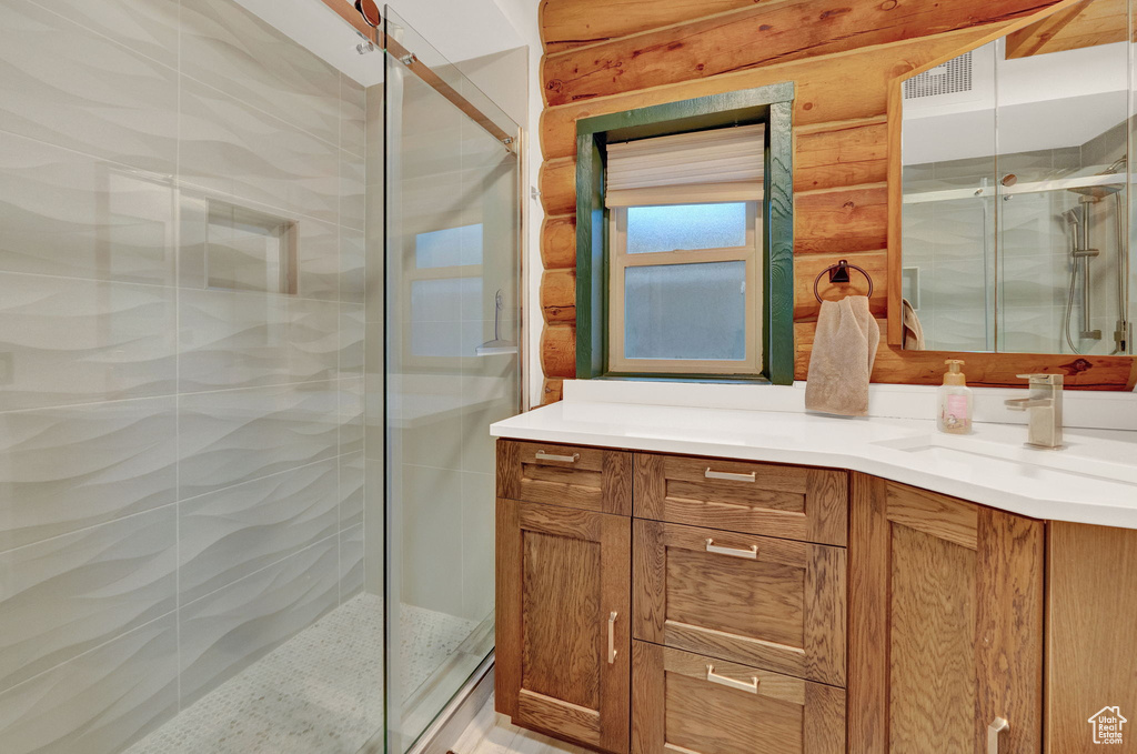 Bathroom with vanity and an enclosed shower
