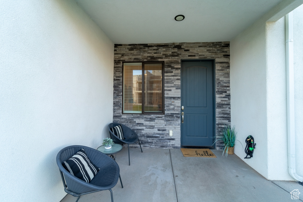 Property entrance with a patio