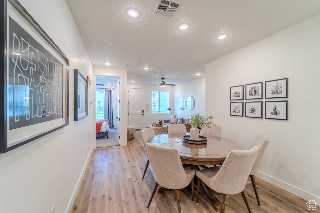 Dining area featuring light hardwood / wood-style floors and ceiling fan