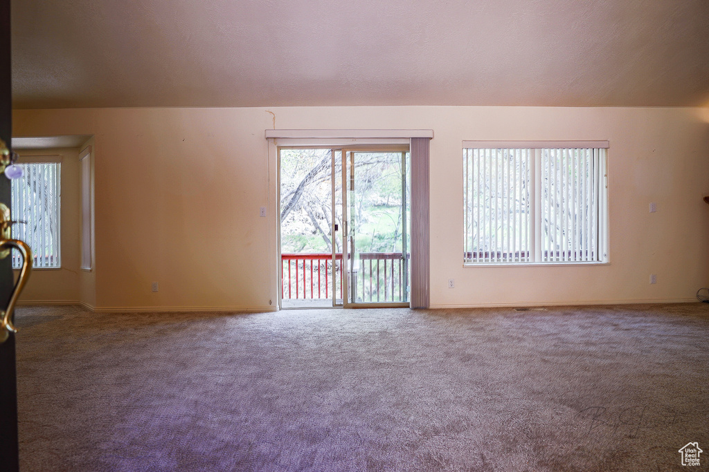 Unfurnished living room with carpet flooring