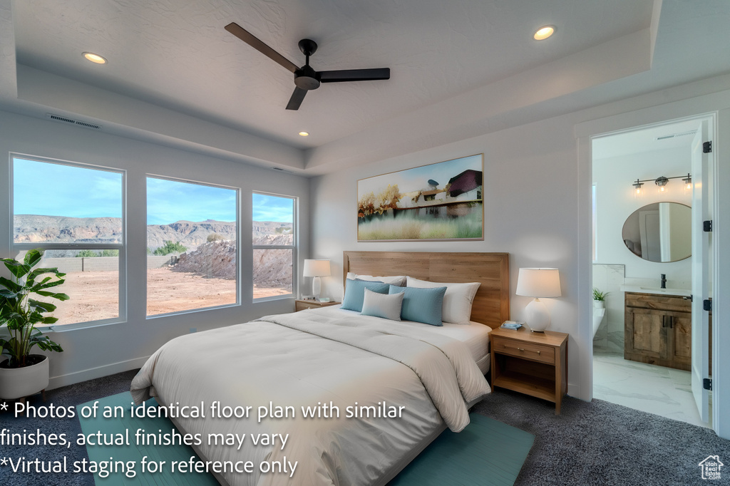 Bedroom with a mountain view, ensuite bath, tile flooring, a raised ceiling, and ceiling fan