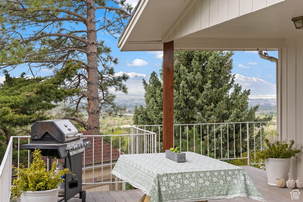 Balcony featuring a mountain view and a grill