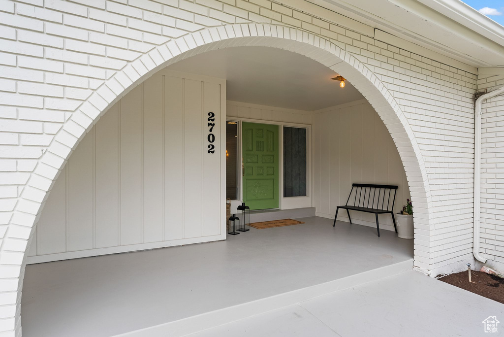 Property entrance featuring covered porch