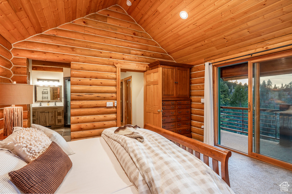 Carpeted bedroom with log walls, lofted ceiling, access to exterior, and wooden ceiling