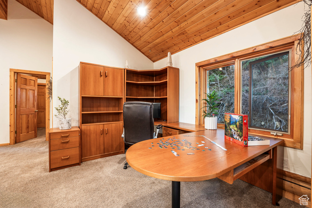 Carpeted office space featuring high vaulted ceiling and wood ceiling