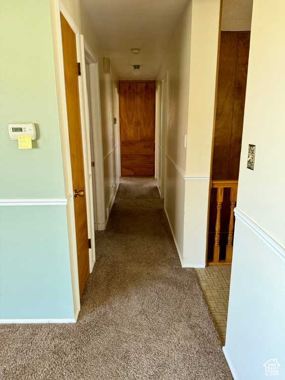 Hallway with carpet flooring