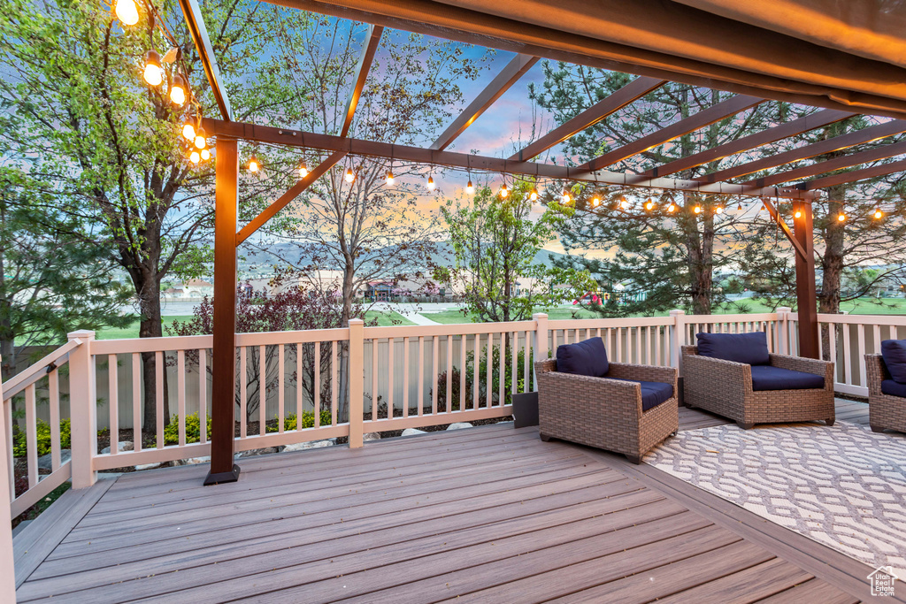 Deck at dusk with a pergola