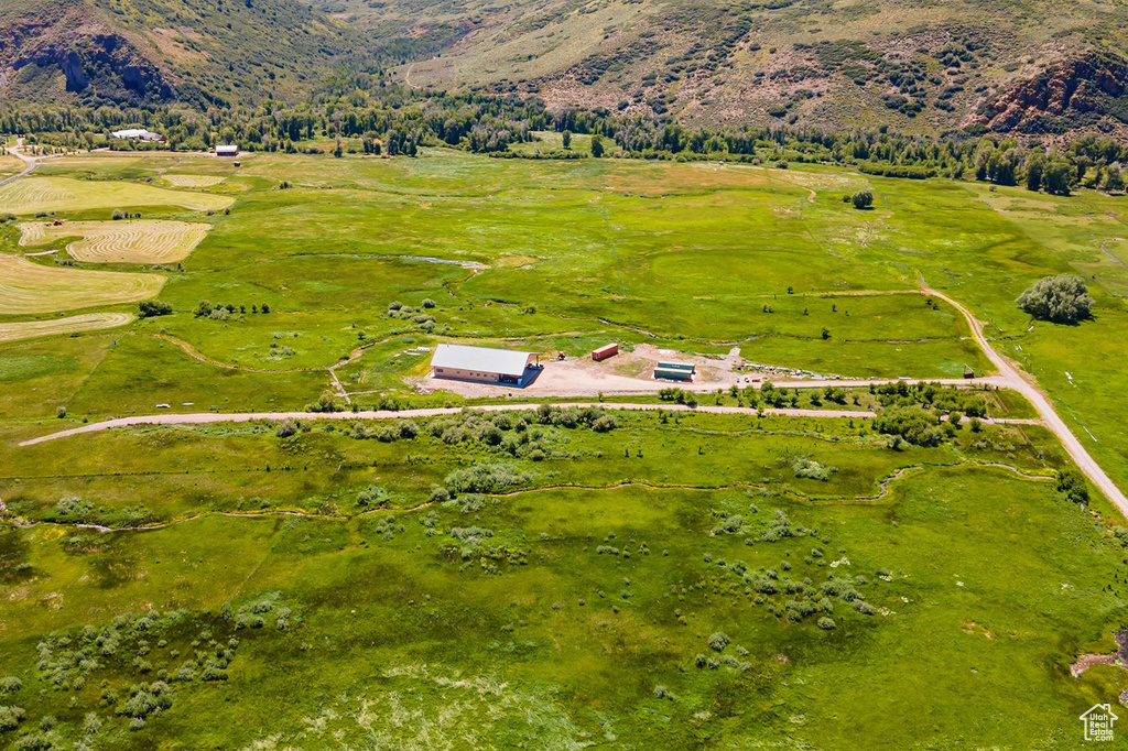 Birds eye view of property featuring a mountain view and a rural view