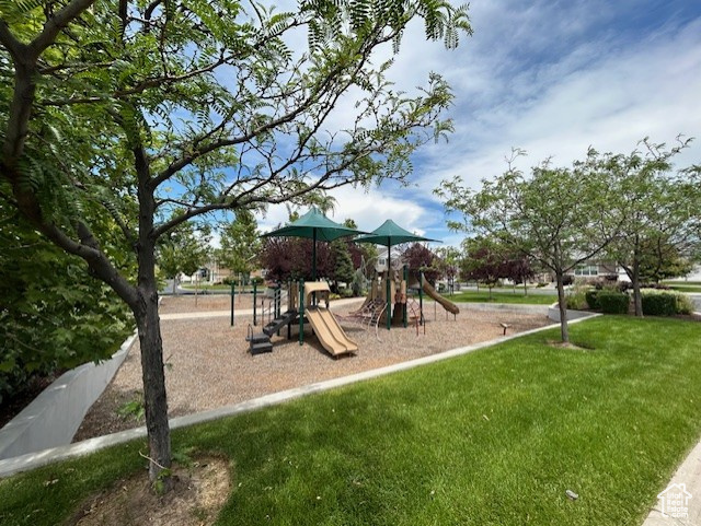 View of play area featuring a yard