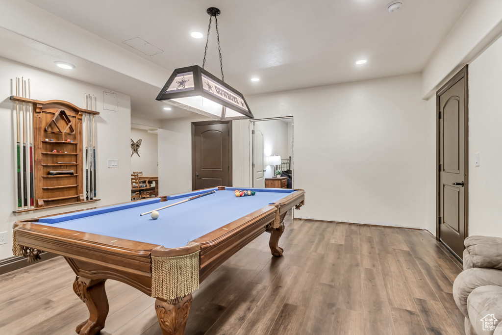 Recreation room with hardwood / wood-style floors and pool table