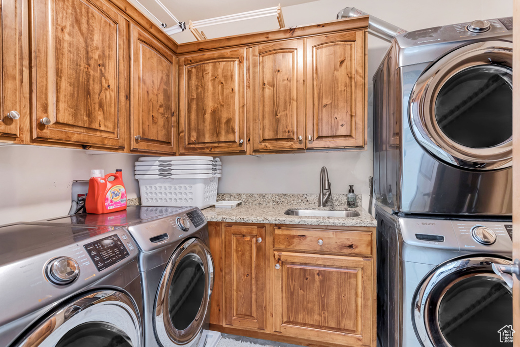 Laundry room featuring sink, cabinets, and hookup for a washing machine