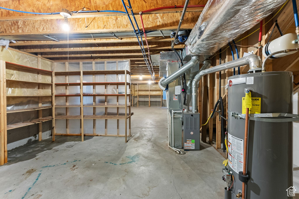 Basement featuring heating utilities and gas water heater