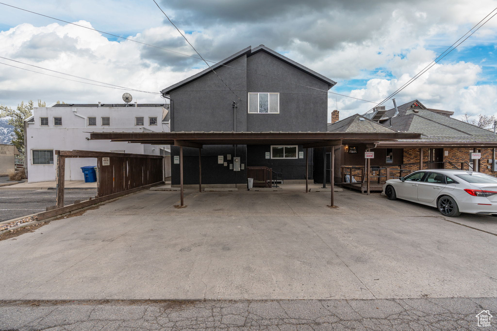 View of front of property featuring a carport