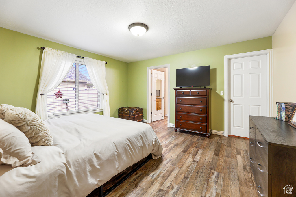 Bedroom featuring wood-type flooring