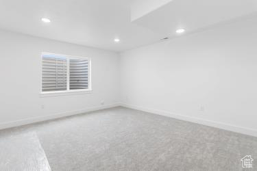 Unfurnished room with recessed lighting, carpet, and baseboards