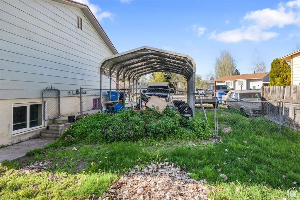 View of yard featuring a carport
