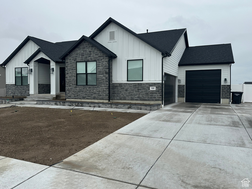 Modern farmhouse style home with a garage