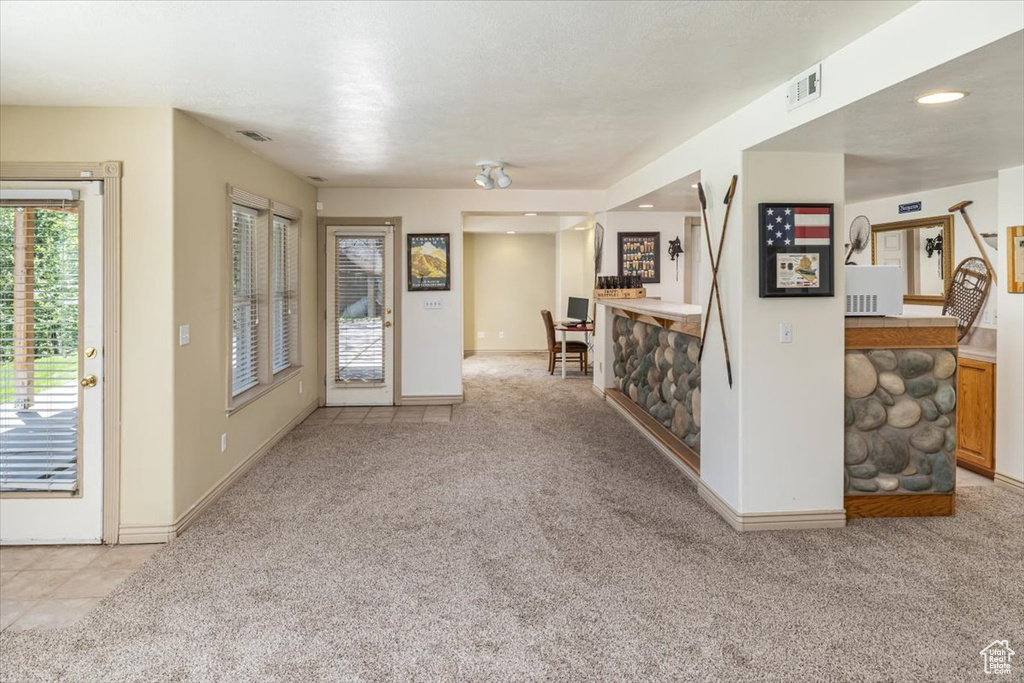Interior space with light colored carpet
