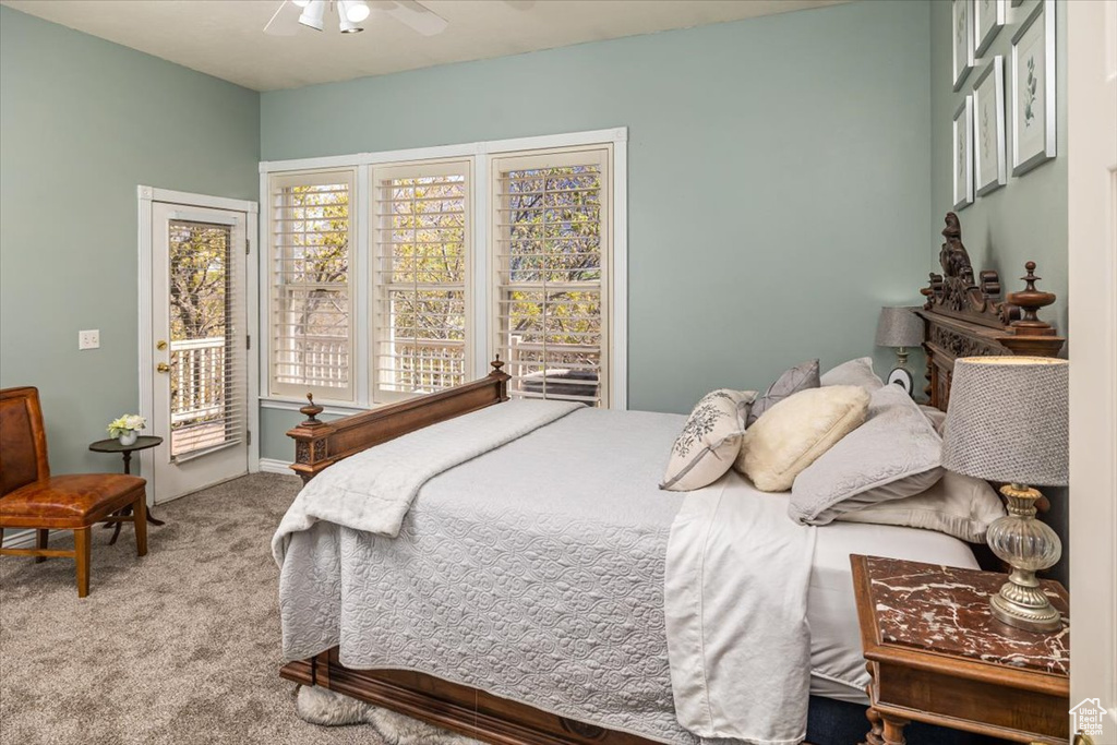 Bedroom featuring carpet floors, ceiling fan, and access to exterior