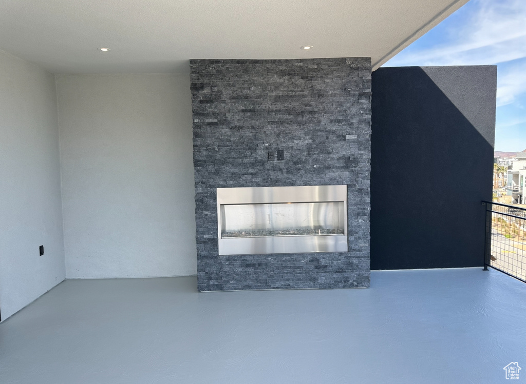 Unfurnished living room with concrete floors