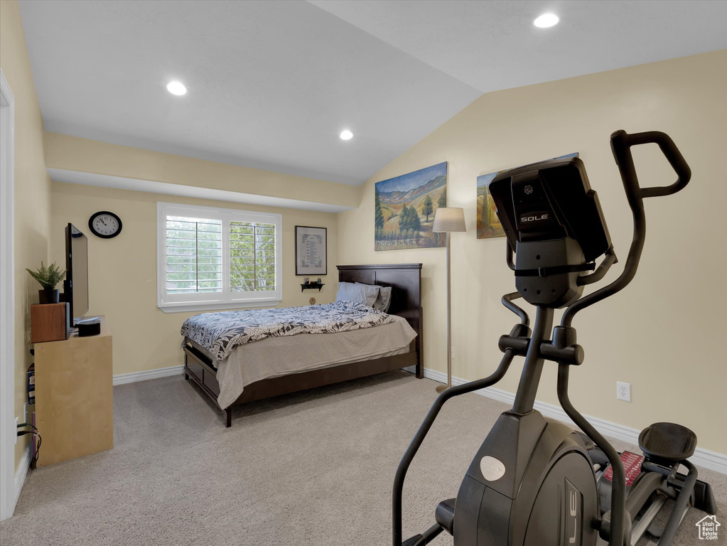 Bedroom with carpet and lofted ceiling