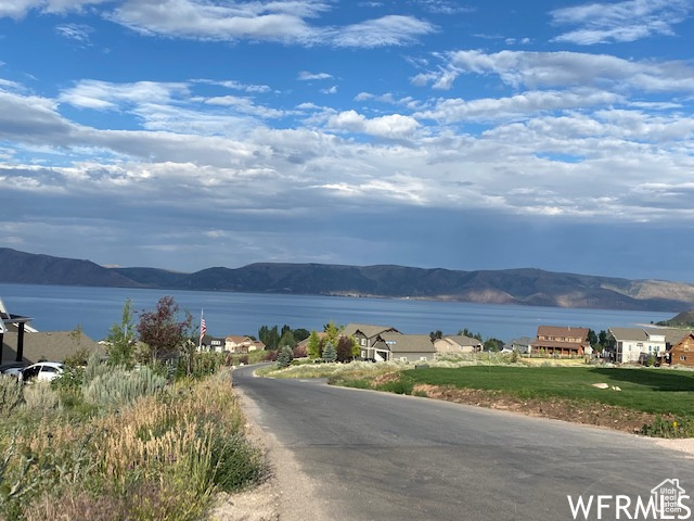 Property view of water with a mountain view