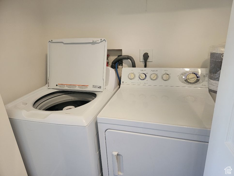 Washroom with hookup for an electric dryer, washer and dryer, and washer hookup
