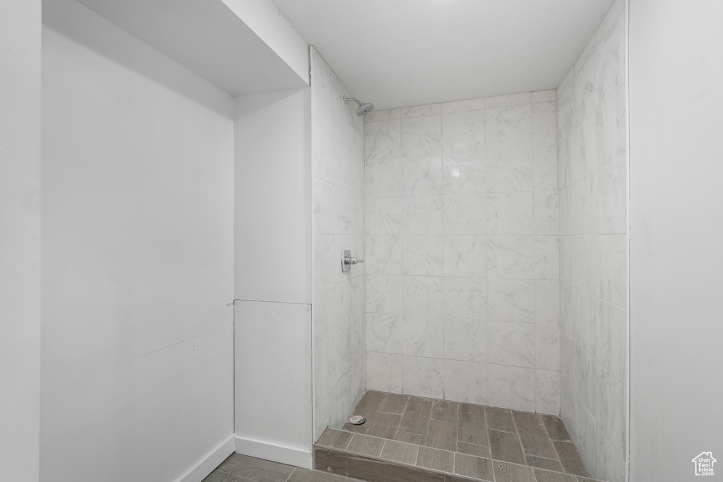 Bathroom with tile floors and a tile shower