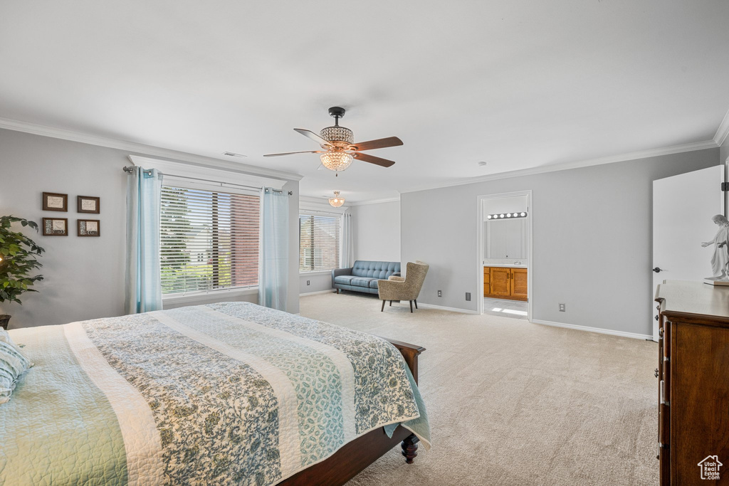 Bedroom featuring ceiling fan, light carpet, ensuite bathroom, and ornamental molding