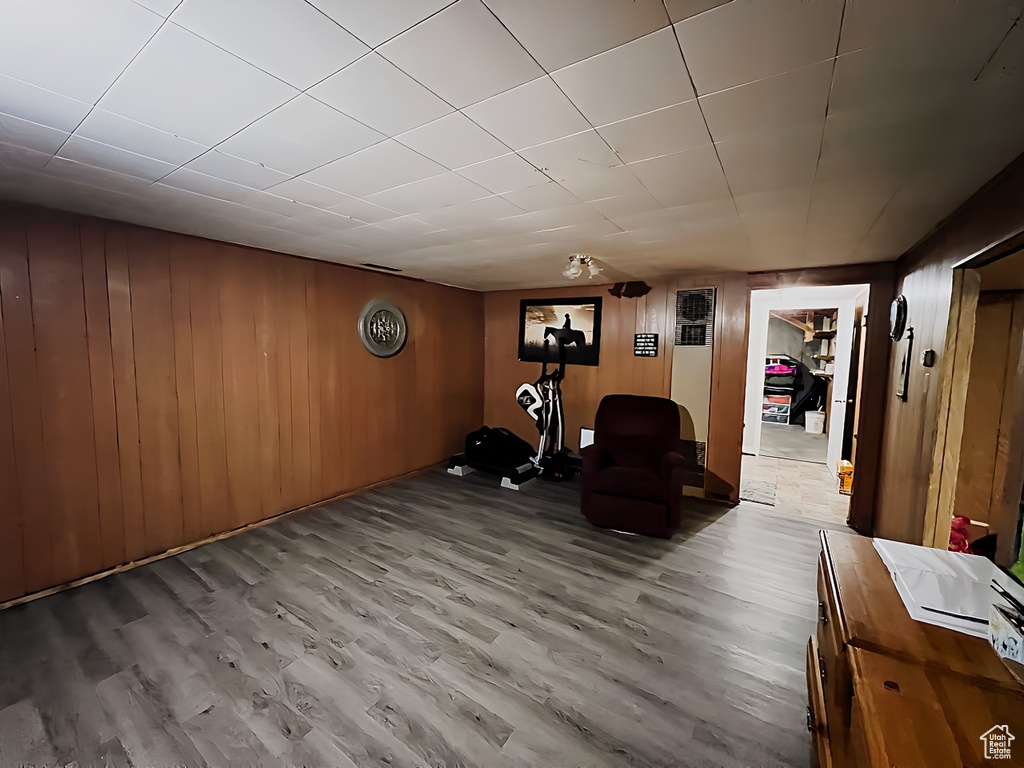 Interior space featuring hardwood / wood-style flooring and wooden walls