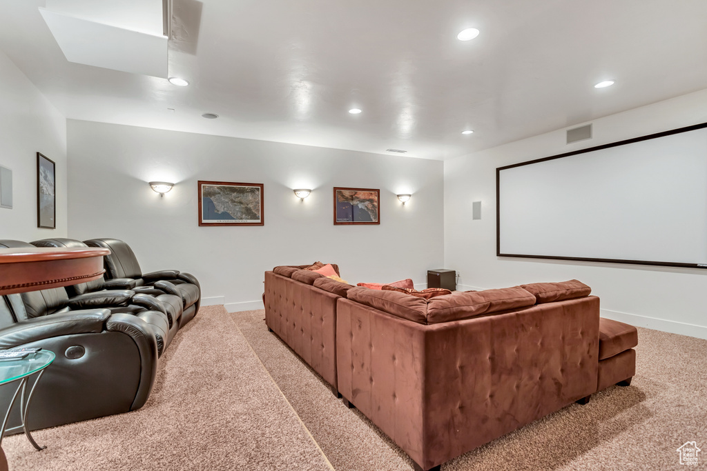 Cinema room with light colored carpet