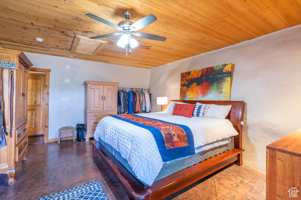 Bedroom with wooden ceiling and ceiling fan