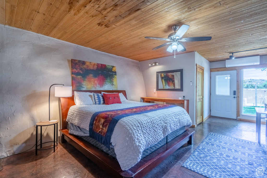 Bedroom with wooden ceiling, ceiling fan, an AC wall unit, and concrete flooring